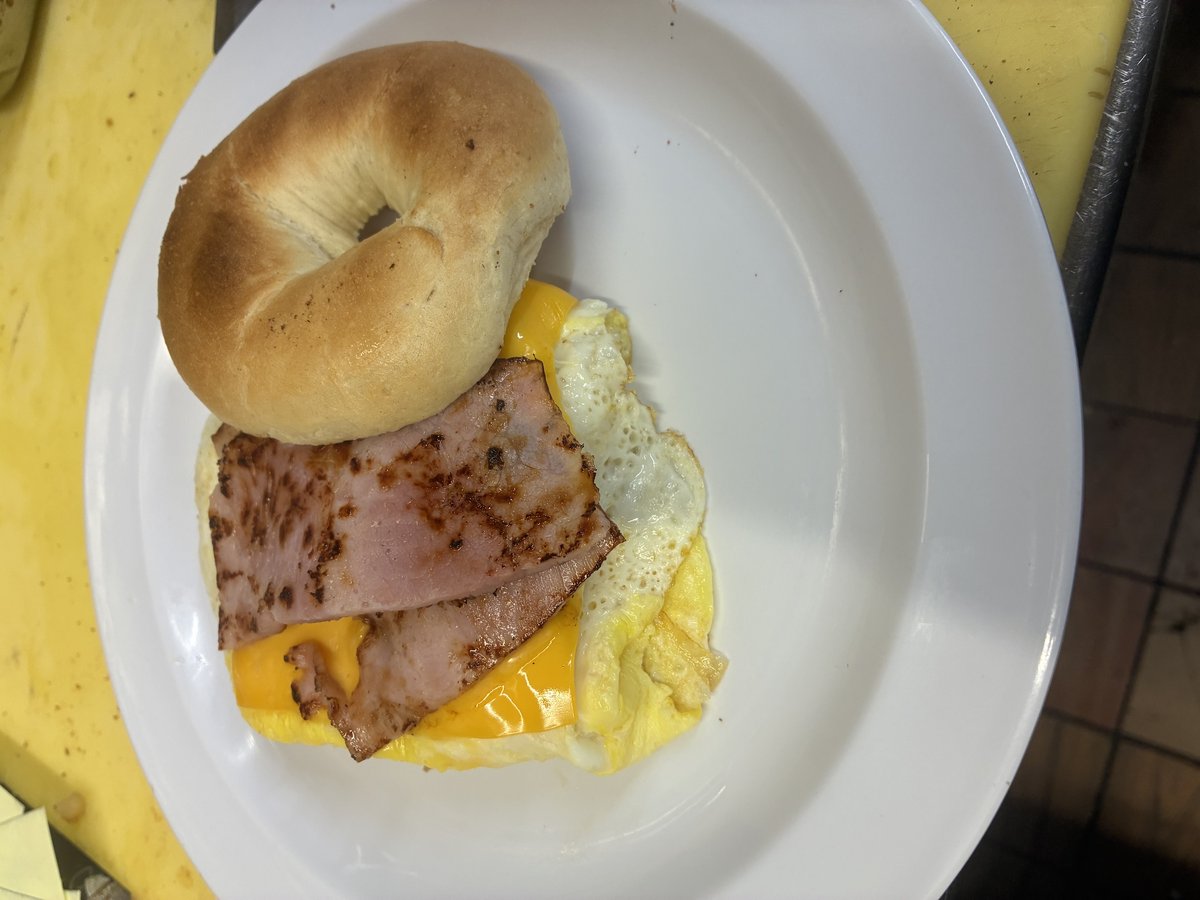 An egg, ham and cheese breakfast sandwich