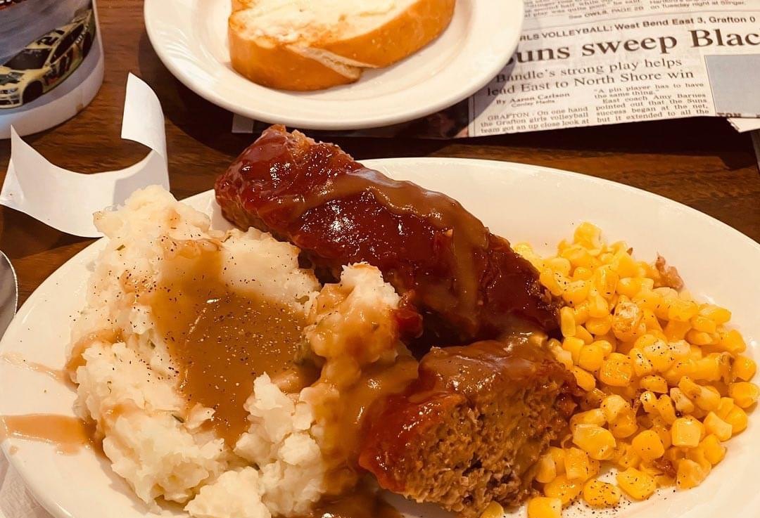 Meatloaf with mashed potato, gravy, sweetcorn and garlic bread